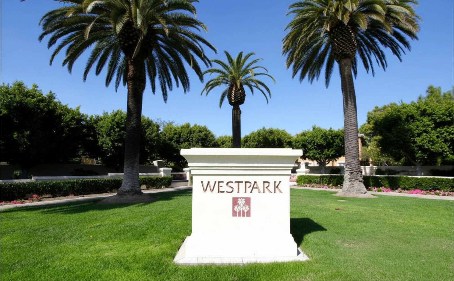 Westpark village entrance monument with palm trees